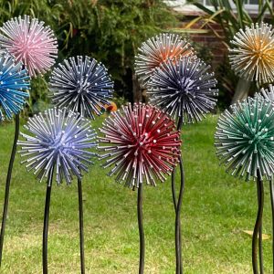 10 Dandelion Garden Stakes in 10 DIFFRENT COLOURS MAID OUT OF NAILS AND OLD GOLF BALL DISPLAYED AS ART